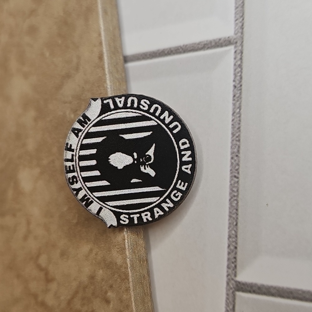 Strange and Unusual  Pin - Black and White